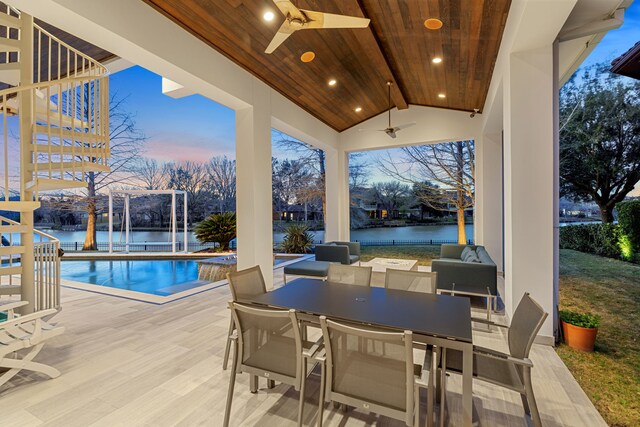 15618 Oyster Cove Dr, Sugar Land, TX 77478 - view of patio / terrace with a ceiling fan, a water view, an outdoor pool, stairs, and outdoor dining area