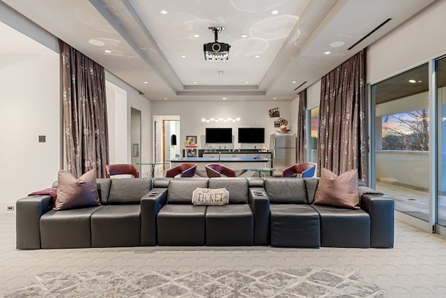15618 Oyster Cove Dr, Sugar Land, TX 77478 - home theater featuring a tray ceiling, recessed lighting, and light carpet