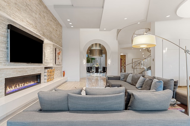 15618 Oyster Cove Dr, Sugar Land, TX 77478 - living area with a fireplace, stairway, a high ceiling, and wood finished floors