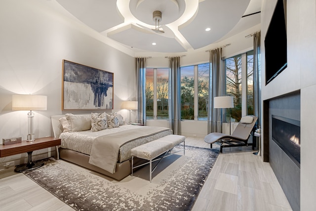 15618 Oyster Cove Dr, Sugar Land, TX 77478 - bedroom with a lit fireplace and recessed lighting