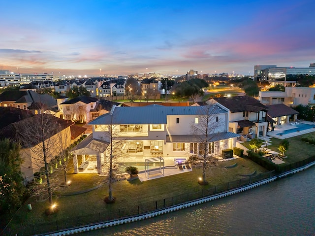 15618 Oyster Cove Dr, Sugar Land, TX 77478 - aerial view at dusk of a water view and a residential view