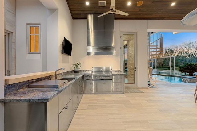15618 Oyster Cove Dr, Sugar Land, TX 77478 - kitchen featuring wall chimney exhaust hood, wooden ceiling, recessed lighting, ceiling fan, and dark stone counters