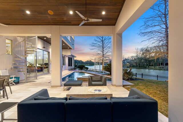 15618 Oyster Cove Dr, Sugar Land, TX 77478 - patio terrace at dusk featuring stairs, a ceiling fan, a water view, and a patio