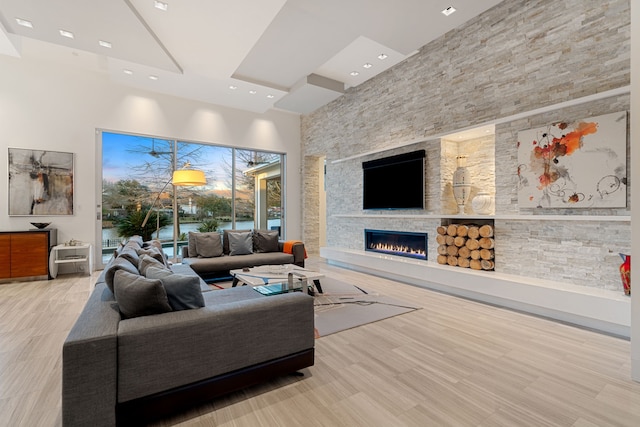 15618 Oyster Cove Dr, Sugar Land, TX 77478 - living room with a high ceiling, a fireplace, and recessed lighting