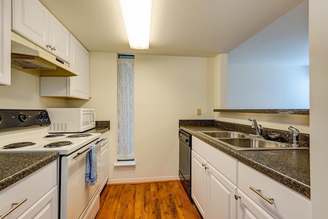 3500 Tangle Brush Dr Unit 7, The Woodlands, TX 77381 - kitchen featuring dark countertops, white appliances, under cabinet range hood, white cabinets, and a sink