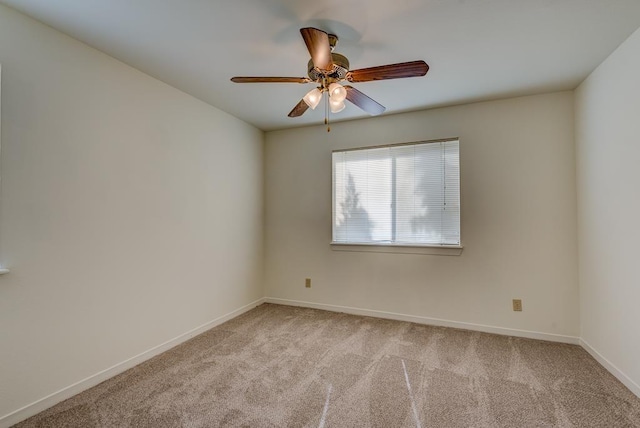3500 Tangle Brush Dr Unit 7, The Woodlands, TX 77381 - spare room featuring ceiling fan, light carpet, and baseboards