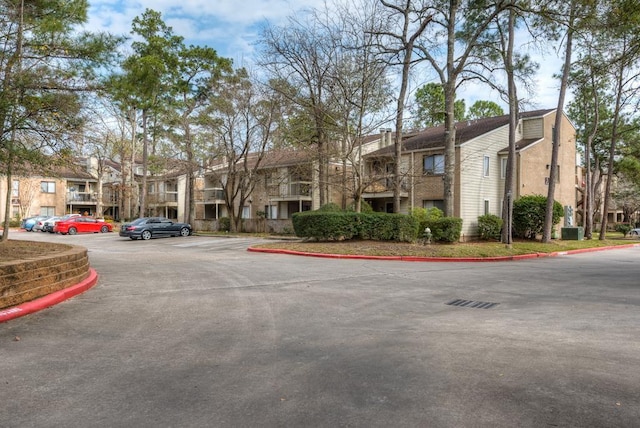 3500 Tangle Brush Dr Unit 7, The Woodlands, TX 77381 - view of property with a residential view and uncovered parking