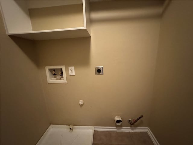 clothes washing area with laundry area, baseboards, hookup for a washing machine, electric dryer hookup, and hookup for a gas dryer