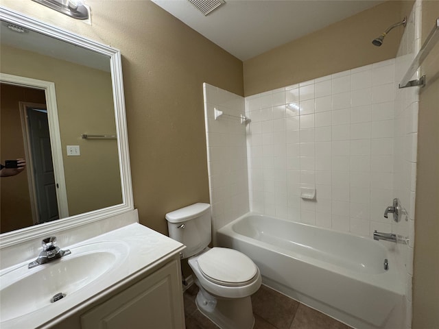 bathroom featuring visible vents, vanity, toilet, shower / tub combination, and tile patterned floors