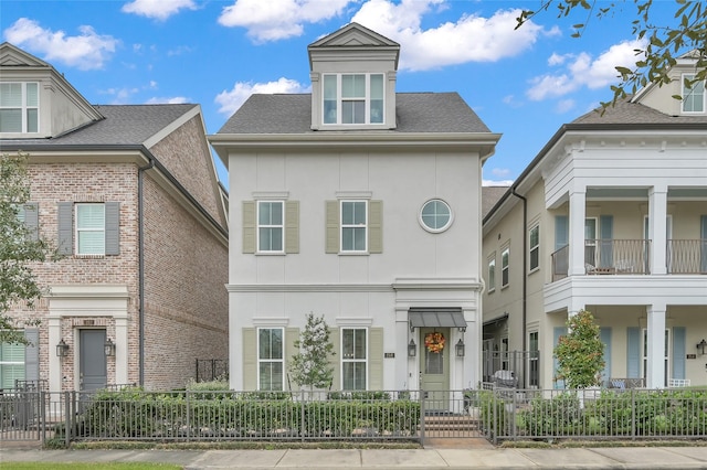 258 Green Blvd, Shenandoah, TX 77384 - view of front facade featuring a fenced front yard and stucco siding