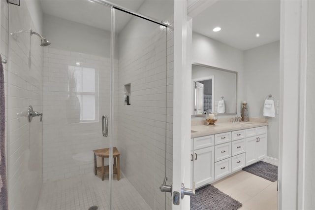 258 Green Blvd, Shenandoah, TX 77384 - bathroom with double vanity, a shower stall, a sink, tile patterned floors, and recessed lighting