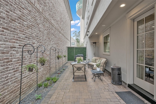 258 Green Blvd, Shenandoah, TX 77384 - view of patio / terrace featuring a fenced backyard and outdoor lounge area