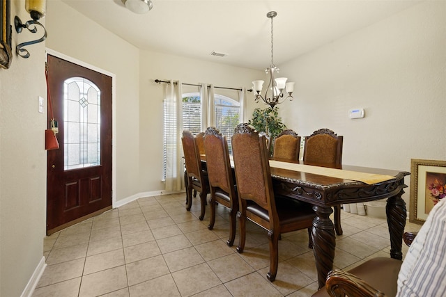dining area featuring a chandelier, plenty of natural light, light tile patterned floors, and visible vents