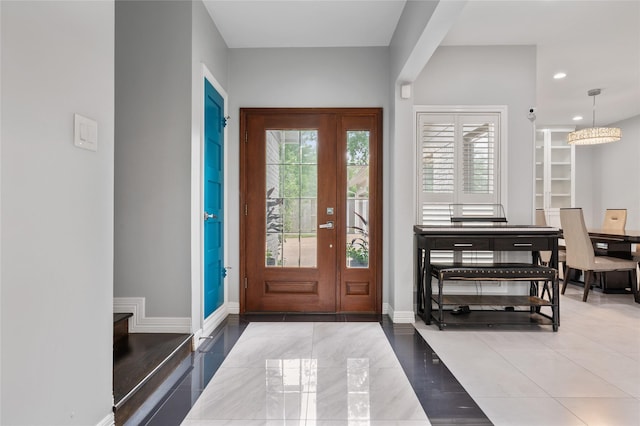 foyer entrance featuring baseboards, recessed lighting, and tile patterned flooring
