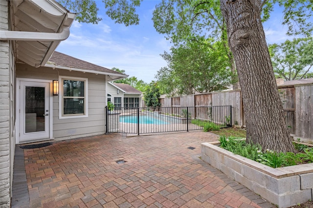 view of swimming pool featuring a fenced backyard, a fenced in pool, and a patio area