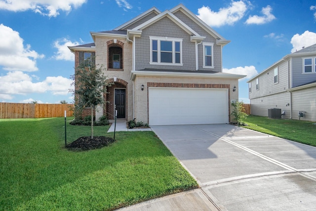 view of front of property with a front yard, fence, cooling unit, concrete driveway, and an attached garage