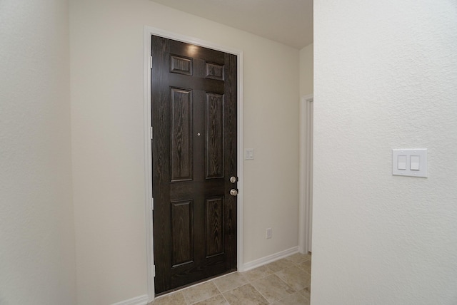 interior space featuring baseboards