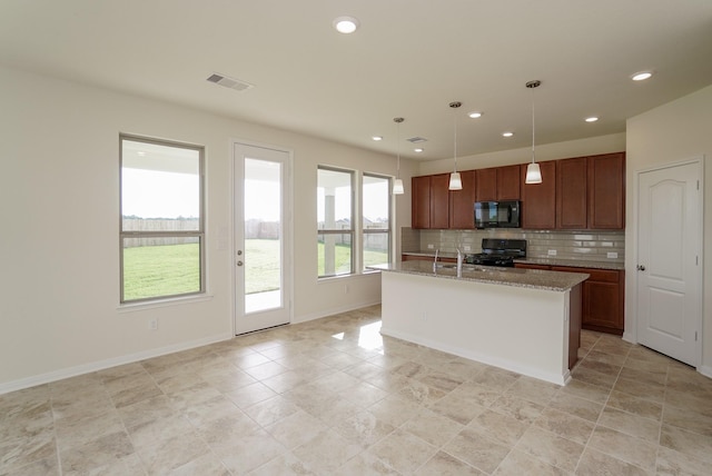 kitchen featuring decorative backsplash, visible vents, hanging light fixtures, black appliances, and recessed lighting