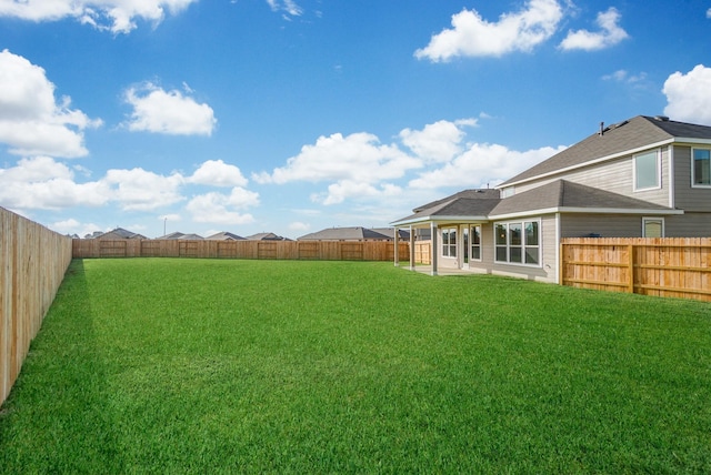 view of yard featuring a fenced backyard