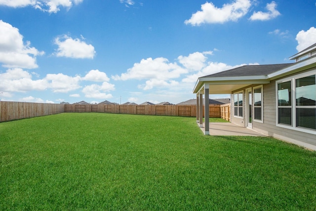 view of yard with a fenced backyard and a patio area