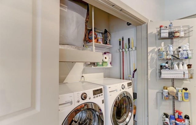 laundry room with washer and dryer and laundry area