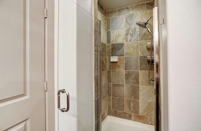 full bathroom featuring a stall shower