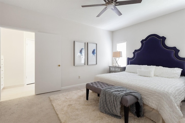 carpeted bedroom with a ceiling fan and baseboards