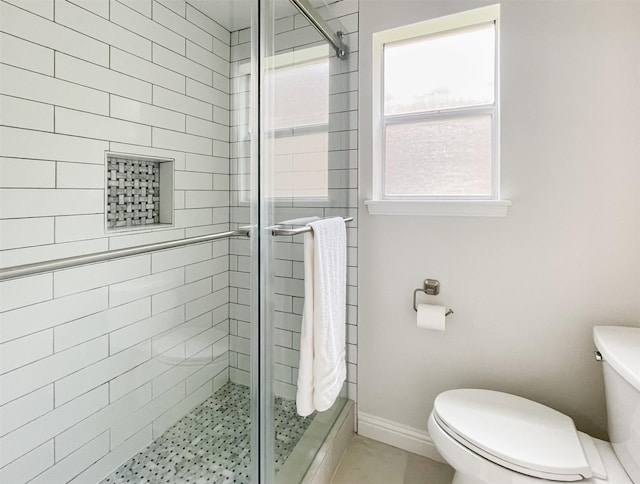 full bath featuring toilet and a shower stall