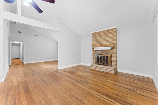 unfurnished living room with visible vents, ceiling fan, vaulted ceiling, and hardwood / wood-style flooring