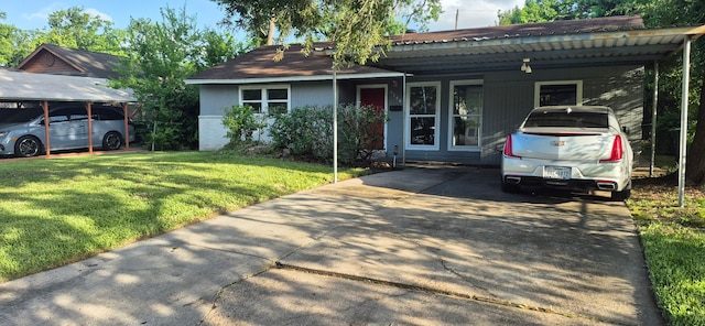 5746 Lakefield Dr, Houston, TX 77033 - ranch-style home featuring a carport, a front lawn, and concrete driveway