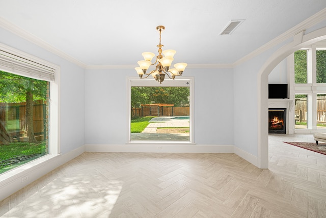 unfurnished dining area with an inviting chandelier, baseboards, visible vents, and a wealth of natural light