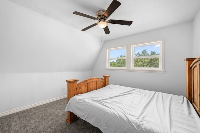 bedroom with baseboards, lofted ceiling, ceiling fan, and carpet