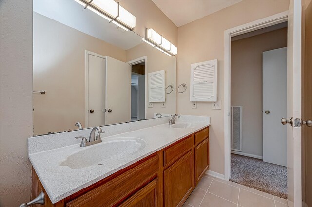 3022 Sam Houston Dr, Sugar Land, TX 77479 - bathroom featuring double vanity and tile patterned flooring