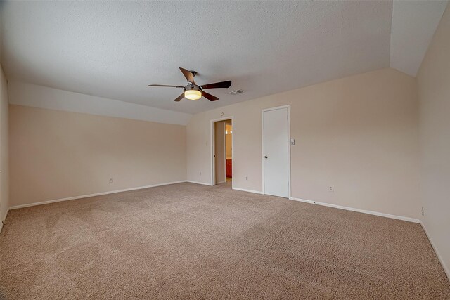 3022 Sam Houston Dr, Sugar Land, TX 77479 - carpeted empty room with a ceiling fan, vaulted ceiling, and a textured ceiling