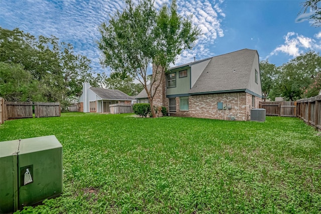 3022 Sam Houston Dr, Sugar Land, TX 77479 - rear view of property with brick siding, a fenced backyard, and a shingled roof
