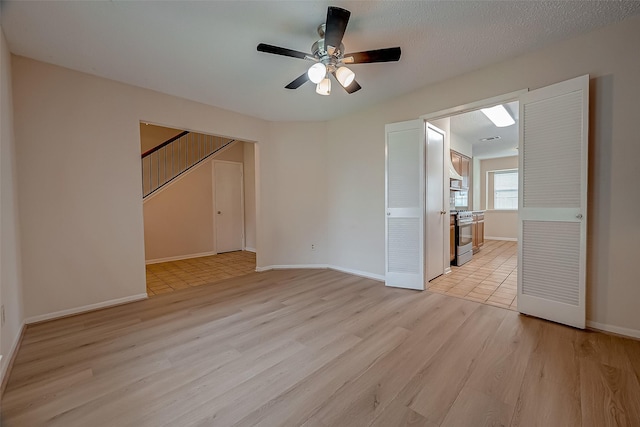 3022 Sam Houston Dr, Sugar Land, TX 77479 - spare room with light wood-style floors and ceiling fan