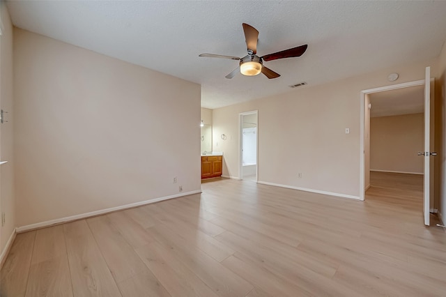 3022 Sam Houston Dr, Sugar Land, TX 77479 - spare room featuring a ceiling fan, light wood-type flooring, and a smoke detector