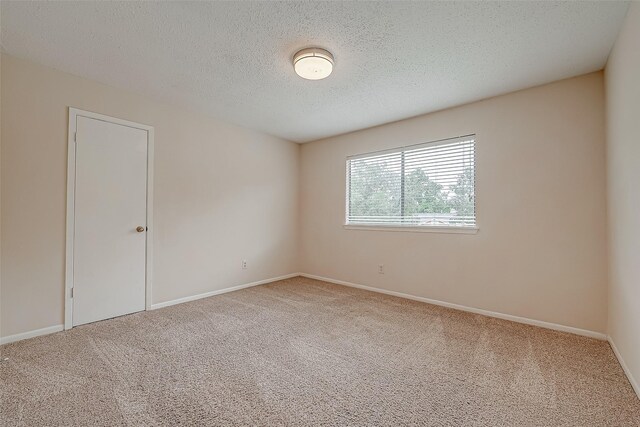 3022 Sam Houston Dr, Sugar Land, TX 77479 - spare room with carpet floors and a textured ceiling