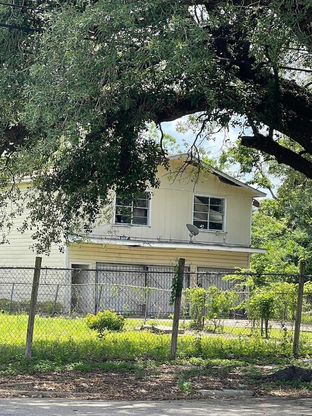 view of side of home featuring fence private yard