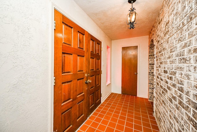 interior space featuring dark tile patterned floors