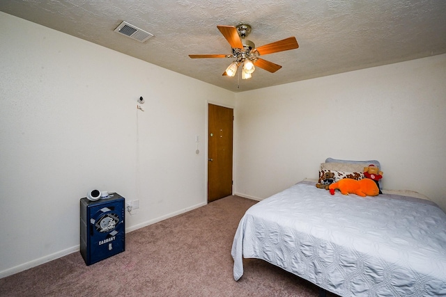 bedroom featuring a textured ceiling, carpet, a ceiling fan, baseboards, and visible vents