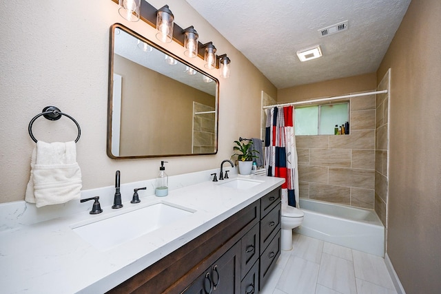 bathroom with visible vents, a sink, shower / bath combo with shower curtain, and toilet