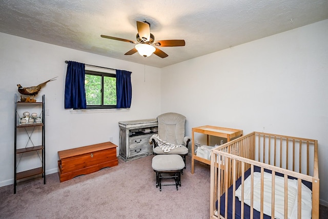 bedroom featuring carpet floors, a ceiling fan, and baseboards
