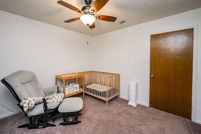 14135 Limerick Ln, Tomball, TX 77375 - carpeted bedroom with a textured ceiling, a ceiling fan, and baseboards