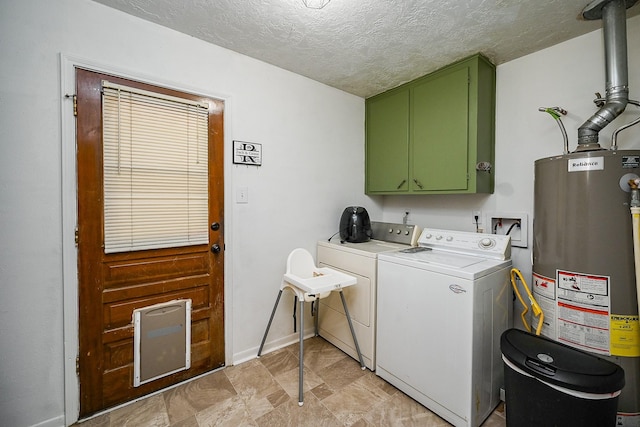laundry area with baseboards, independent washer and dryer, a textured ceiling, cabinet space, and water heater