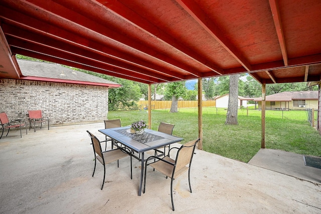 14135 Limerick Ln, Tomball, TX 77375 - view of patio / terrace with outdoor dining space and an outbuilding