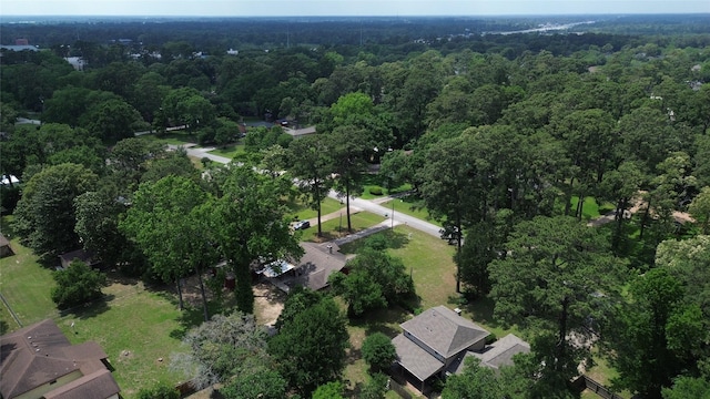 birds eye view of property with a forest view