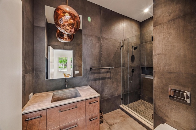 bathroom featuring vanity and a shower stall