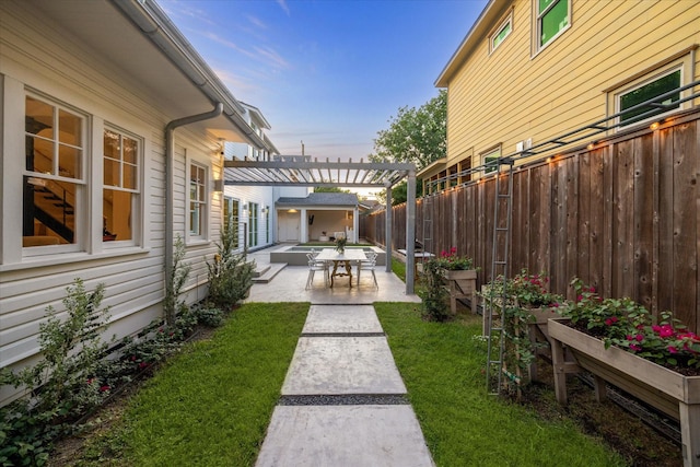 view of yard featuring a patio, a pergola, and a fenced backyard