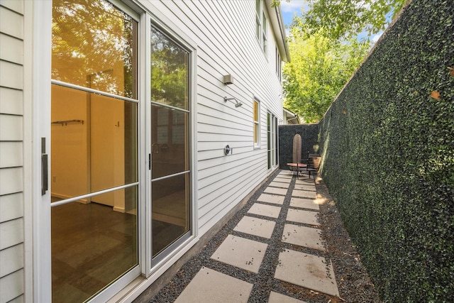 view of home's exterior featuring fence